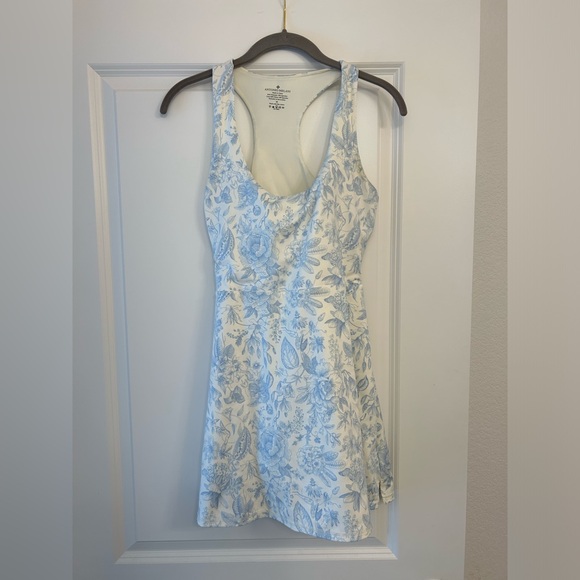 ANTONIO MELANI Tops - NWOT ANTONIO MELANI White Racerback ExerciseDress with Light Blue Floral Detail